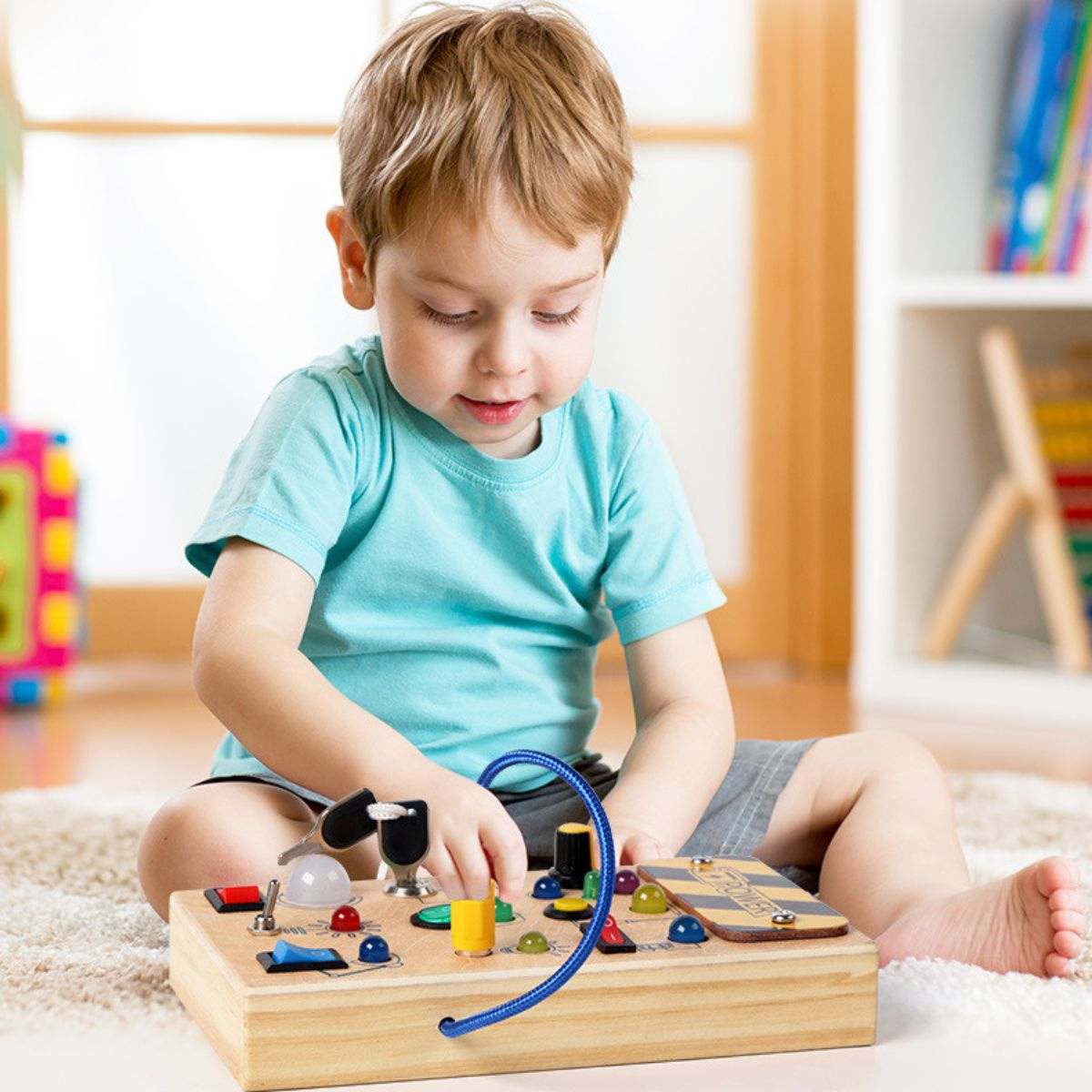 Toddly Montessori Busy Board wooden sensory toy with LED lights, switches, and buttons for kids 3+