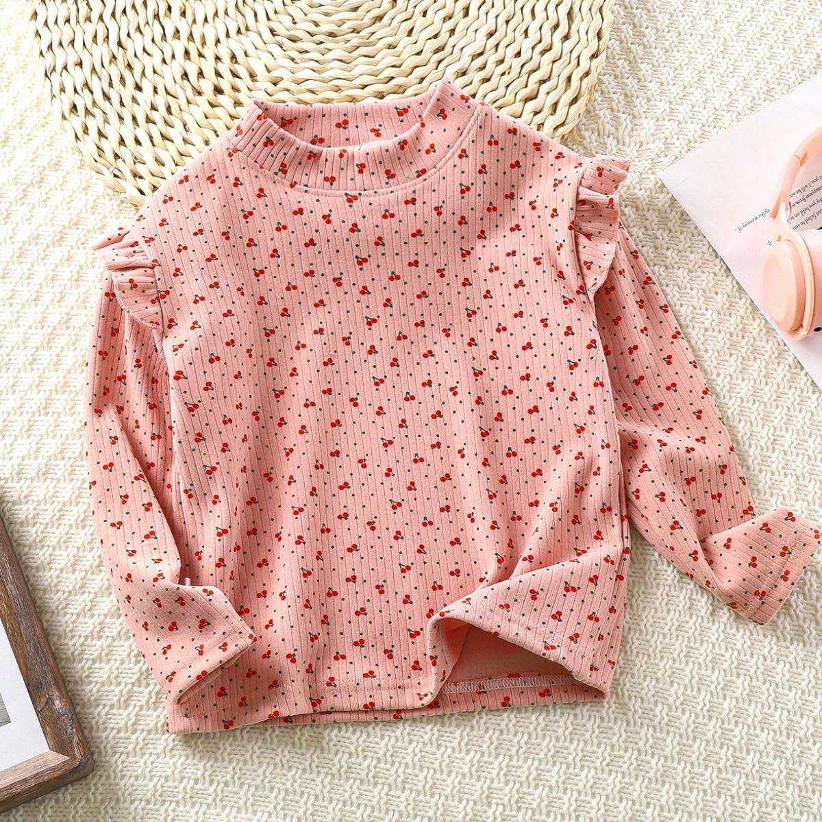 Toddler wearing Feather & Fawn ribbed ruffle long sleeve top in winter print