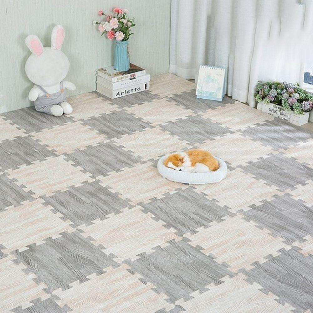 BabiePlay Wood Grain Play Mat EVA foam puzzle mat soft safe non-slip baby exercise gym floor mat with wood grain design and pet resting on it