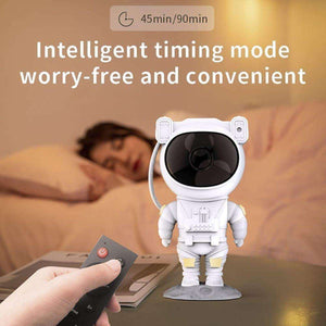 Glowly Astronaut LED galaxy projector with remote control and intelligent timing mode next to sleeping person