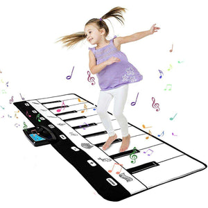 Child playing on Kidst Piano Play Mat musical keyboard dance mat with colorful music notes