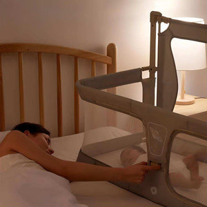 Toddly NightNest Bedside Rail securing baby sleeping safely beside parent in bed