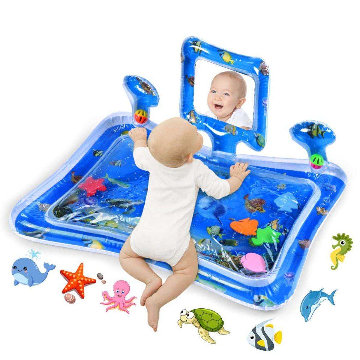 Baby playing on blue Toddly SplashMirror tummy time water mat with mirror and floating sea animals for sensory development