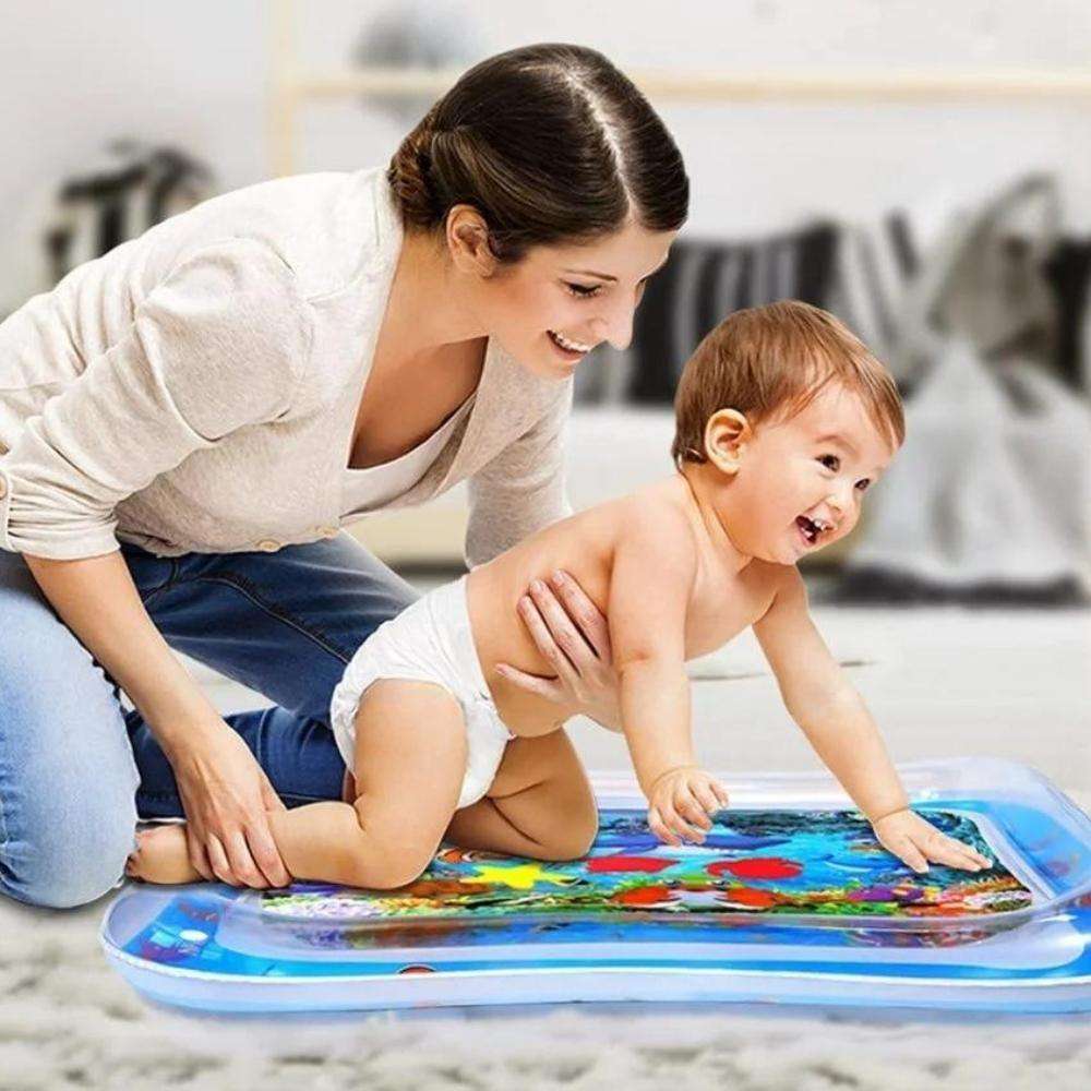 Baby lying on tummy time water play mat