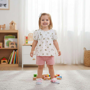 Feather & Fawn vintage floral cotton baby tunic with puff sleeves