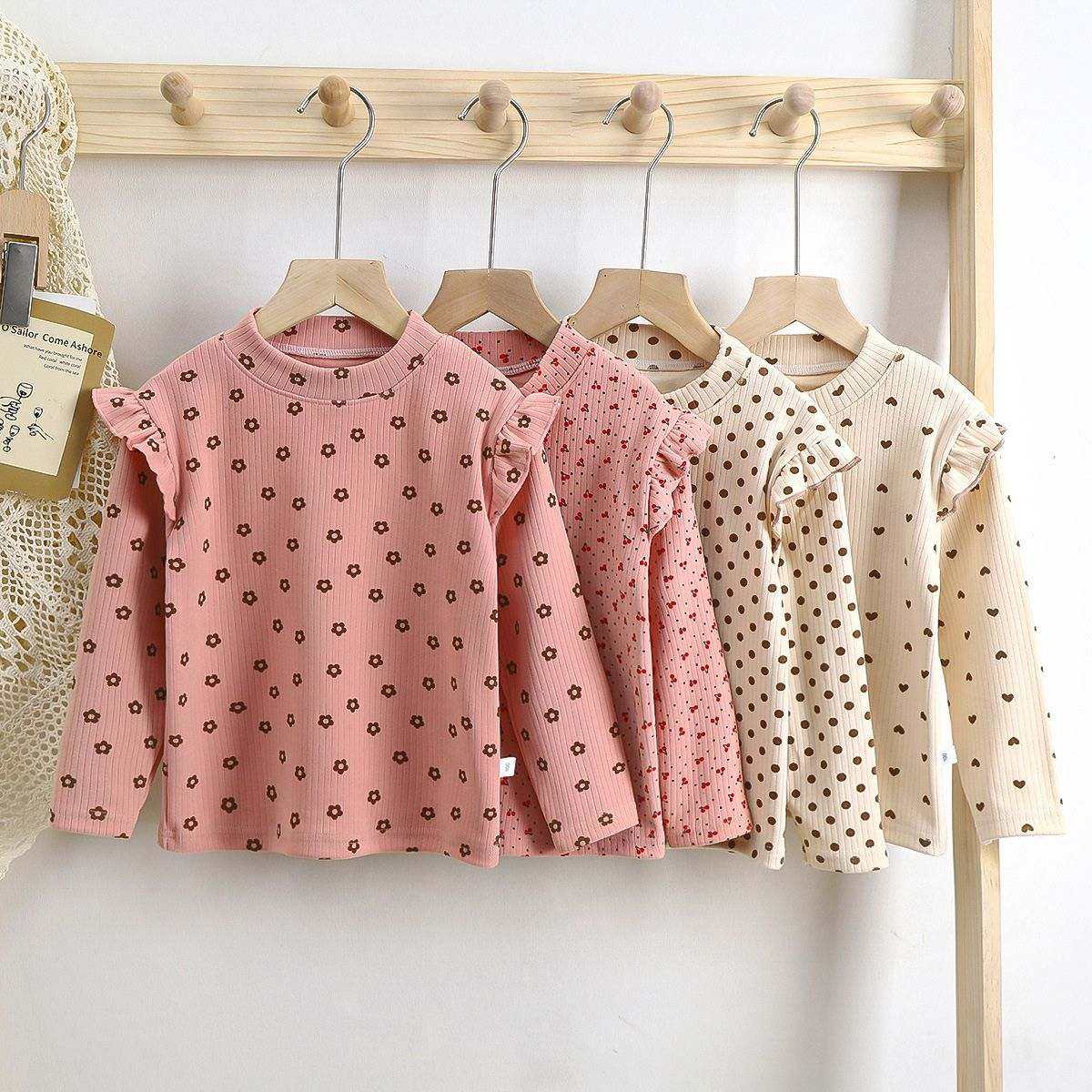 Toddler wearing Feather & Fawn ribbed ruffle long sleeve top