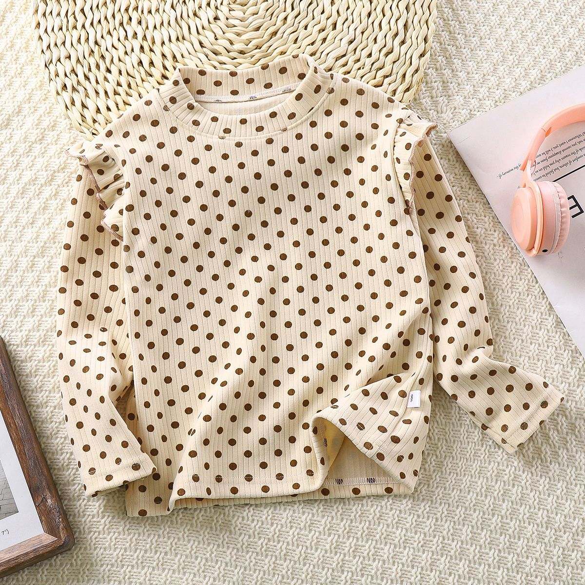 Toddler wearing Feather & Fawn ribbed ruffle long sleeve top