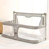 Adjustable Toddly NightNest Bedside Rail with breathable mesh for baby safety on bed